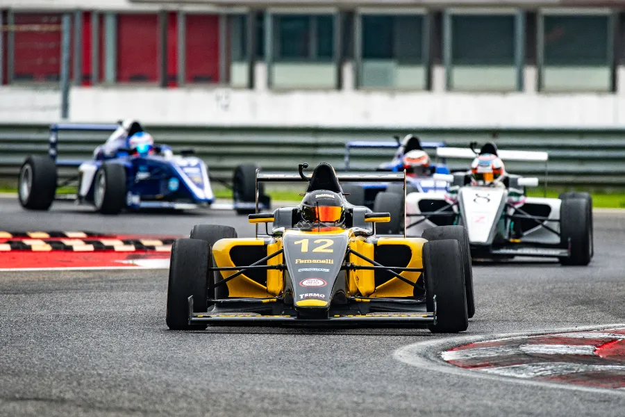 Formula 1 race cars racing in action on the track